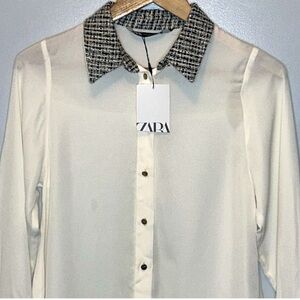 Zara button down shirt,sz large with details on the sleeves and neck.